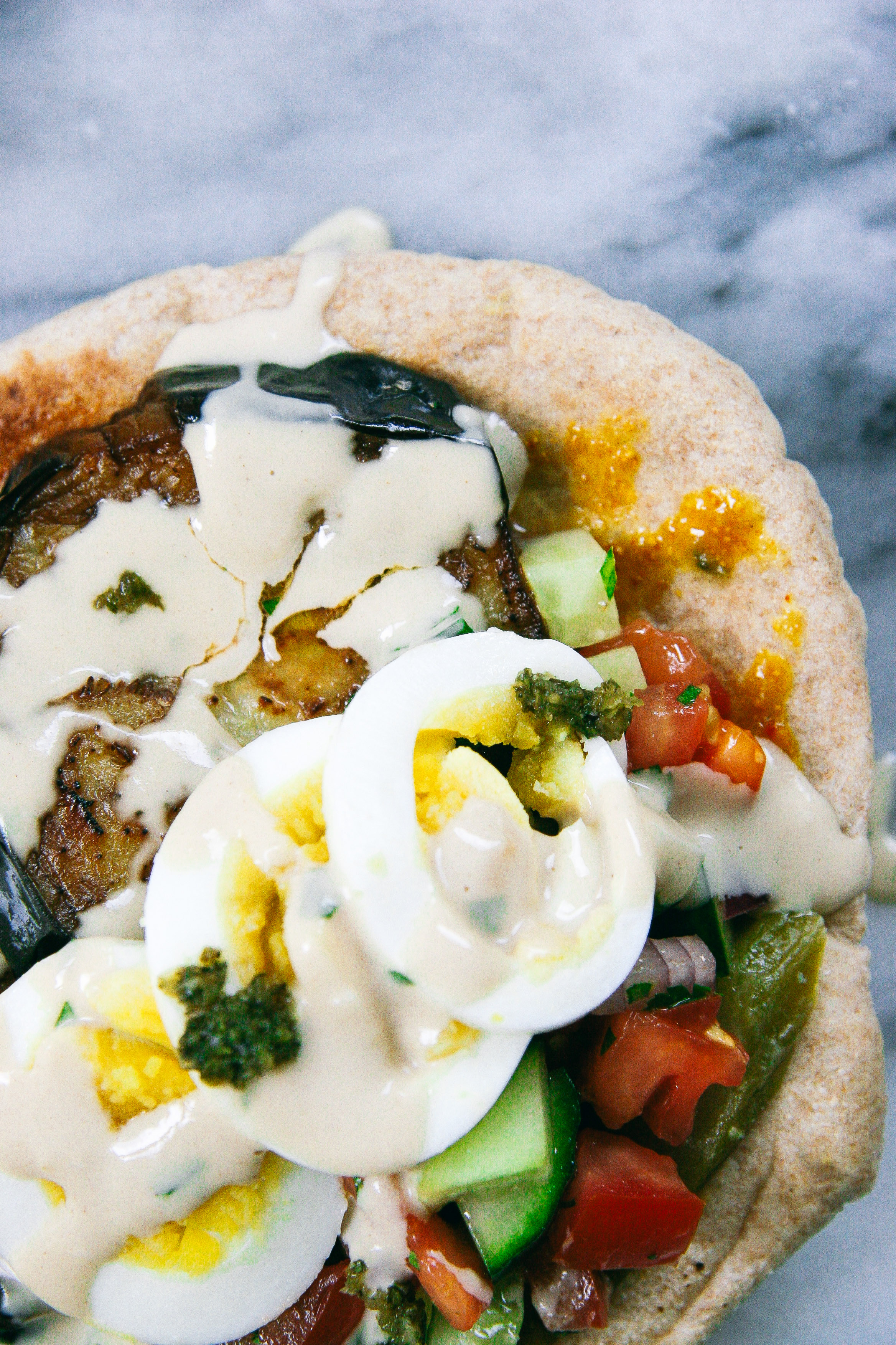 Sabich | Eggplant and Egg Pita Sandwich with Israeli Salad, Pickles, Tahini, Amba, and Schug | I Will Not Eat Oysters