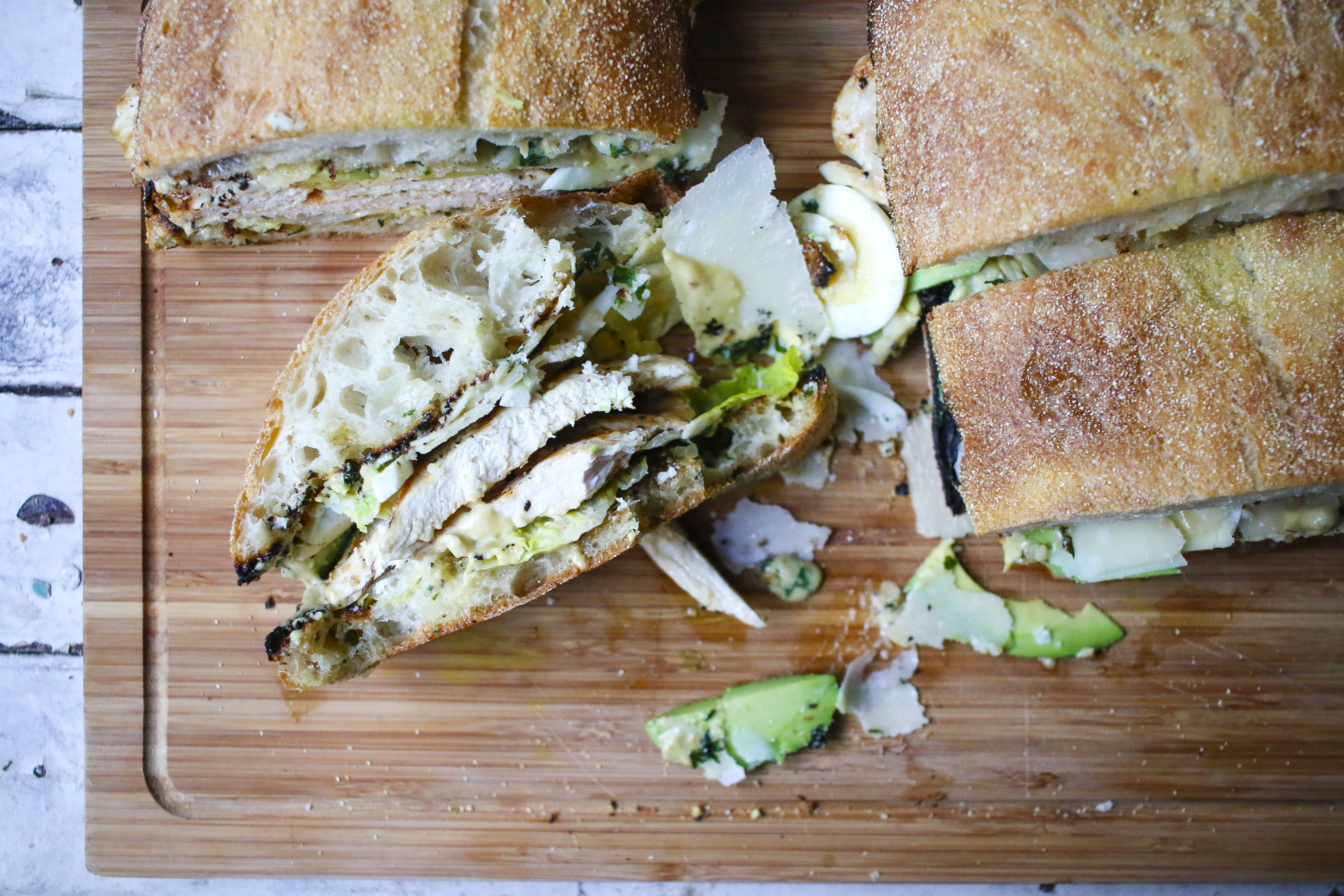 Chicken Caesar Salad Sandwich on Ciabatta Garlic Bread with Homemade Caesar spread, Avocado, Hard boiled eggs, and Shaved Parmesan | I Will Not Eat Oysters
