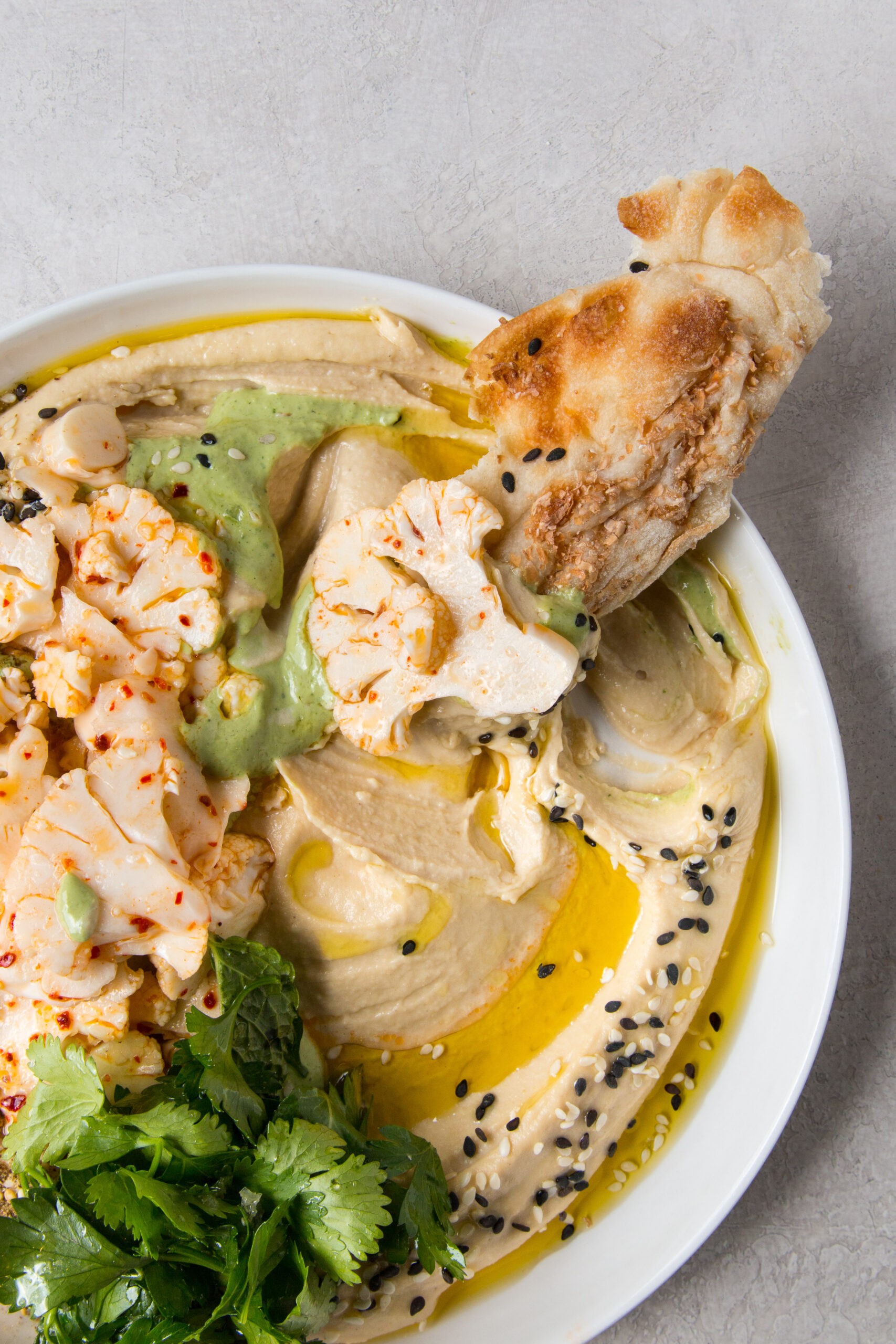 Aleppo Cauliflower Salad and Green Tahini over Hummus