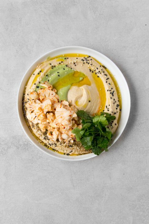 Aleppo Cauliflower Salad and Green Tahini over Hummus