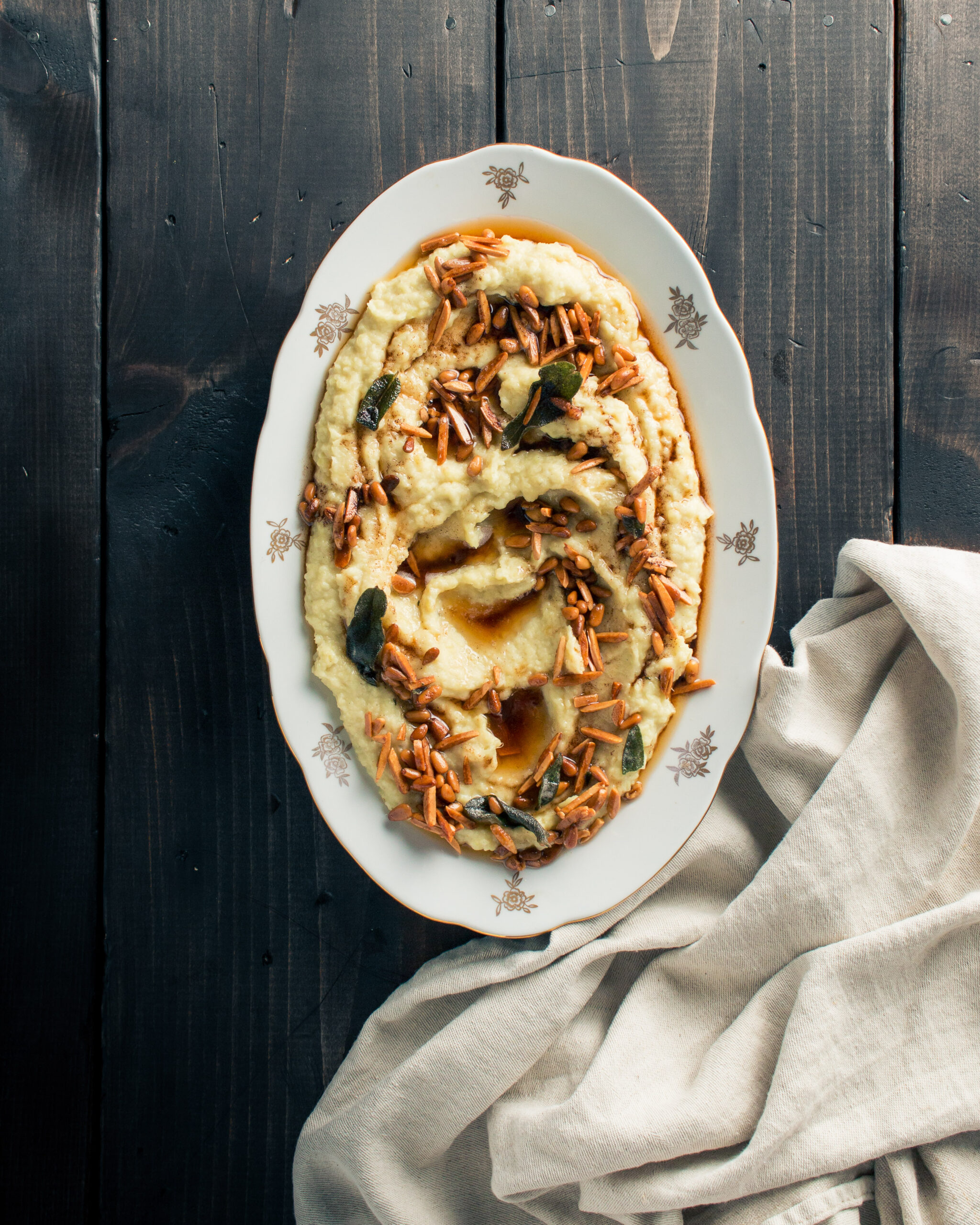 White Sweet Potato Mash with Brown Butter Almonds and Pine Nuts