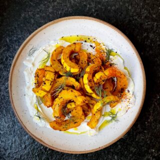 Roasted Delicata Squash with Urfa & Spices over Labne makes an excellent side for any weeknight dinner! Recipe below and SAVE THIS FOR LATER! Perfect for an easy dinner party side for this season! This is a non-recipe recipe which means I don’t want you to pull out any measuring spoons or cups!

Delicata Squash, sliced into 1/2” crescent moons
lots of extra virgin olive oil
turmeric
sweet or hot paprika
Urfa pepper flakes, or regular red pepper flakes, can also use chipotle powder
kosher salt
Labne
Dill for garnish

-Pre-heat oven to 435˚F and line a baking sheet with tin foil for easy clean up
-Toss squash with olive oil, turmeric, paprika, pepper flakes and salt.
-Spread them out evenly on the baking sheet.
-Roast for 25-35 minutes until golden brown on the bottom and softened.
-Spread Labne onto serving dish, top with squash, add more olive oil and garnish with dill and spices as you like!

#squash #fall #fallrecipes #recipe #recipereel #holiday #holidayrecipe #pumpkin #delicata #vegan #vegetarian #easyrecipes #weeknightdinner