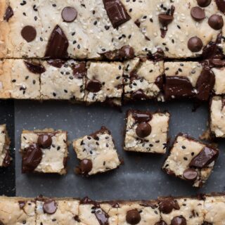 Throwback recipe for Tahini Chocolate Chip Blondies 🙌🏼 SAVE THIS FOR LATER! Link in my profile for printable version. 

• 1 1/2 cups AP Flour (180 g)
• 1 tsp kosher salt
• 8 tbsp unsalted butter, melted (113 g)
• 1 cup granulated sugar (198 g)
• 1/2 cup light brown sugar (105 g)
• 3 large eggs
• 1 cup tahini (sesame paste) (230 g)
• 1 tsp vanilla bean paste or extract
• 1/2 cup semi-sweet chocolate chips, optional (100 g)
• 1/2 cup chopped bittersweet chocolate, optional (100 g)
• black and white sesame seeds, optional
•flakey sea salt

1. Pre-heat oven to 325 °F. Prepare an 8"×8" pan by spraying with cooking spray and lining it with parchment. Leave an over-hang for easy removal.

2. In a medium bowl, mix the flour and salt

3. In a separate large bowl, whisk together the melted butter, sugar and brown sugar.

4. Add the eggs and whisk until homogenous.

5. Add the tahini and vanilla bean paste and mix again until combined.

6. Add the flour mixture and fold to combine until there are no flour streaks left.

7. Add the (optional) chocolate chips and chopped chocolate. Fold to combine.

8. Transfer the batter into the prepared pan. Spread evenly.

9. Garnish with black and white sesame seeds and flakey salt.

10. Bake for 23-24 min for a very gooey blondie or 26-28 for one that is more baked through. Allow to cool!

#baking #blondies #chocolate #sweet #recipes #bakefeed #treatyourself #thebakefeed #dessert #tahini #f52grams #eatvoraciously #foodreels
