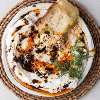 Whipped Feta Dip with Urfa Oil  This 4 – ingredient appetizer is an easy, make-ahead type dip! It’s creamy, salty, spicy, and goes really well with this Olive and Za’atar Focaccia!

URFA CHILI OIL
1/4 cup olive oil
1 tbsp Urfa chili flakes

WHIPPED FETA DIP
8 oz feta cheese
2-3 tbsp feta cheese brine
dill , garnish

FOR THE URFA CHILI OIL
In a small pot, heat the olive oil and Urfa over medium heat while swirling the pot constantly.
Once the Urfa begins to sizzle, count 30 seconds and immediately remove from heat and pour into a heat safe bowl. Allow to cool. This will keep in an air tight container for up to 1 week.

FOR THE WHIPPED FETA DIP
Add the feta cheese and 2-3 tbsp of brine from the feta cheese into a food processor.
Blend on high speed for 2 minutes, scraping down the bowl half way through. It should be thick and creamy, kind of like the consistency of cream cheese. If it is too stiff, add more brine 1/2 tablespoon at a time. This can keep in the fridge for up to 2 days

SERVE
When ready to serve, plate the whipped feta and drizzle with urfa oil. Garnish with dill and serve with bread!

#dip #recipe #recipereel #foodreels #foodreel #recipereels #reels #feta #cheese #shavuot #holiday #holidayeats #chili #chilioil #dips #focaccia #easyrecipe #fastrecipe #appetizer #snack #eatvoraciously #thekitchn #foodbeast #huffposttaste #f52grams #thenosher